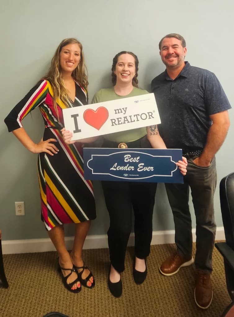 Realtor and clients celebrating a successful loan closing